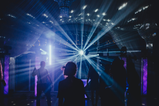 Bright lights on the dance floor of a wedding reception